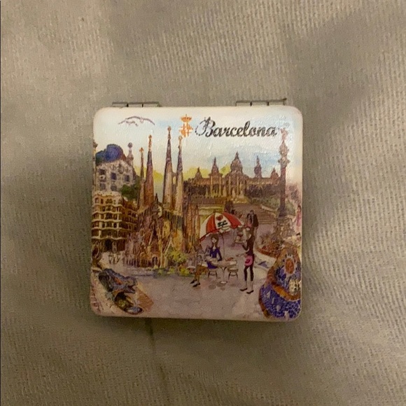A Barcelona wallet and pocket mirror